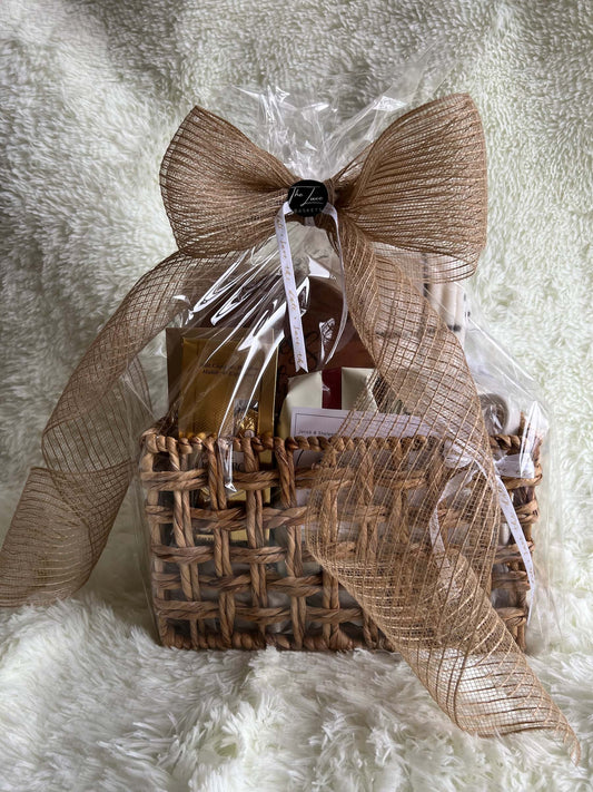Wedding Gift basket with a brown bow on a white textured background